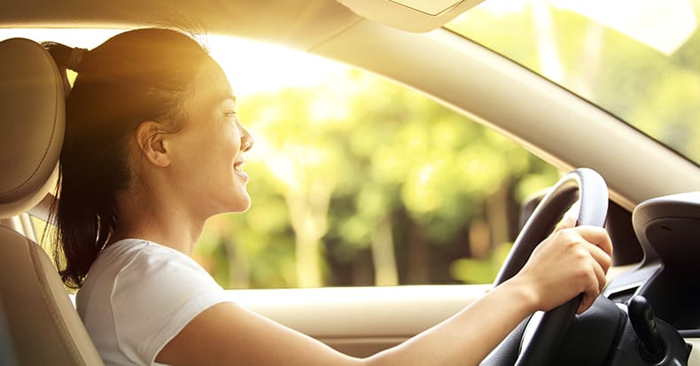 women driving a car