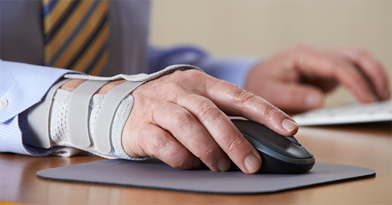 Man in suit wristbrace