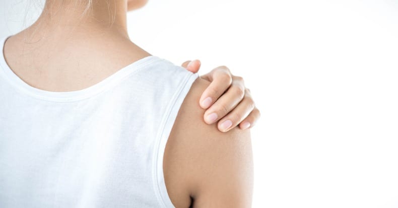 Woman with pain in shoulder pain in the human bodyhealth care concept