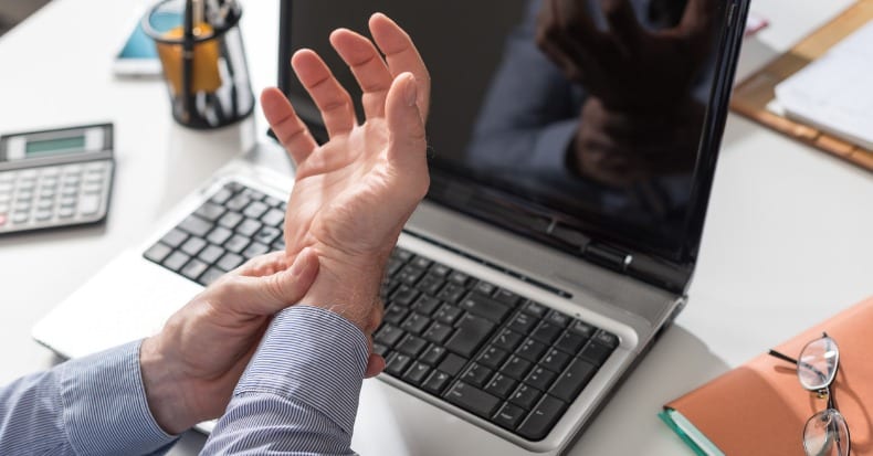 Businessman suffering from wrist pain