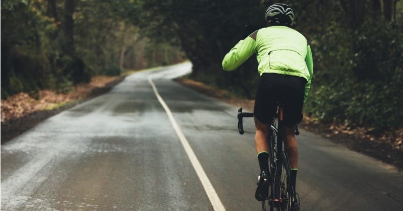 Cyclist practising on a rainy day