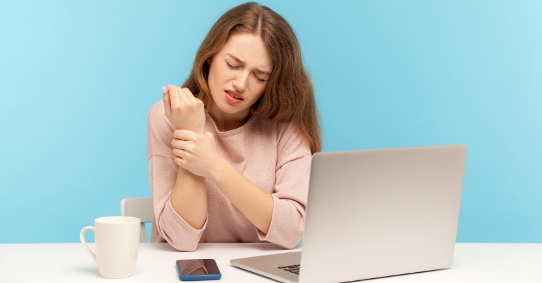 Tired sick woman office employee sitting at workplace with laptop